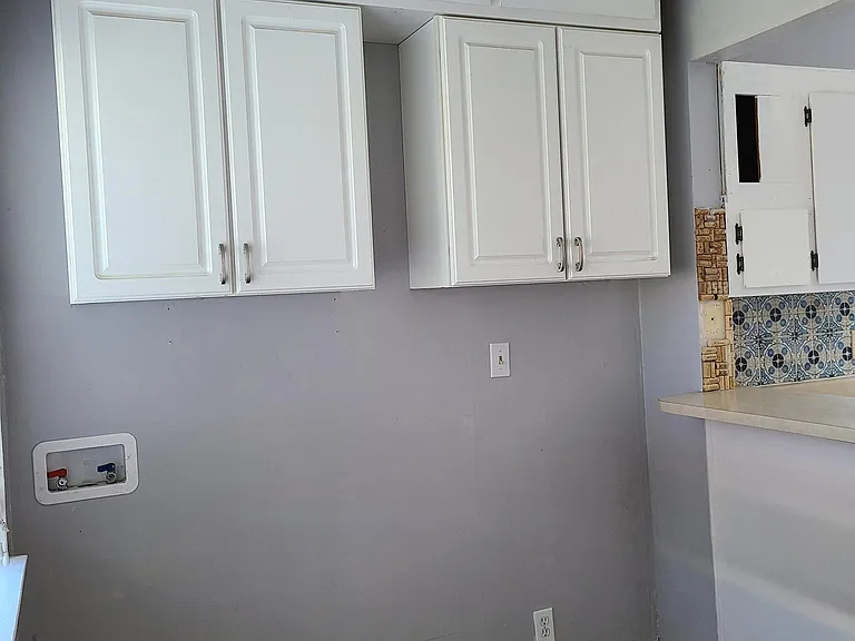 Lots of storage! Washer and dryer hookups conveniently located on the main level ready for you. No need to haul laundry into the basement like other century homes.