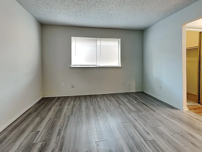 Spacious room with neutral wal