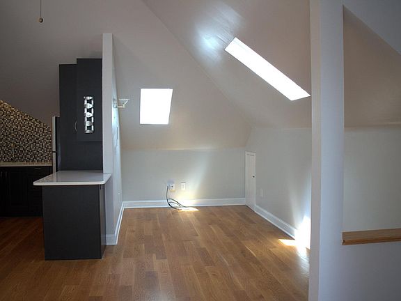 Living area that shares breakfast table/island with kitchen.