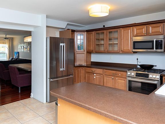 Kitchen includes all new Bosch appliances: Refrigerator, gas stove/oven, dishwasher, and microwave. Plenty of counter space and cabinets.