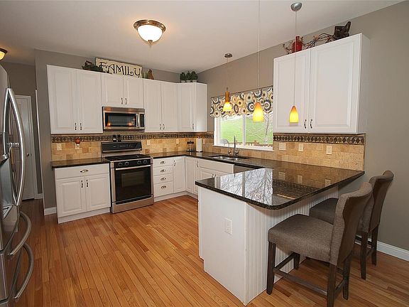 Updated Kitchen with granite and SS appliances.