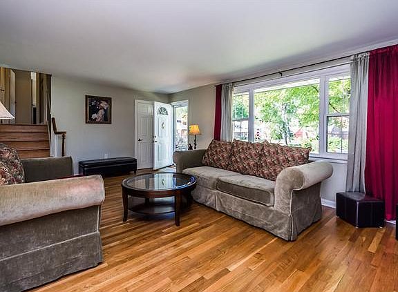 Gleaming hardwd floors welcome you into living rm