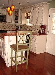 Hardwood flooring and huge island with storage