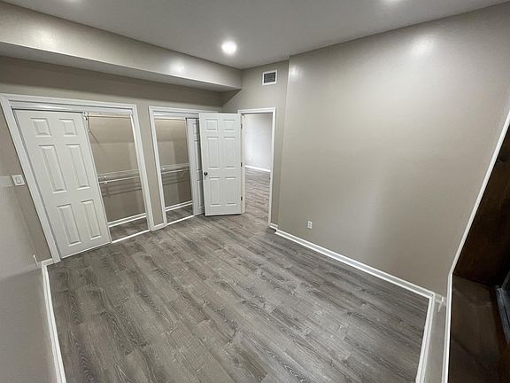 Bedroom with wall-to-wall closet