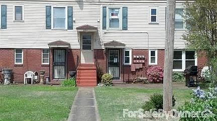 BACK ENTRANCE : CONDO HAS TWO ENTRANCES FRONT TO COURTYARD AND BACK TO PARKING AREA