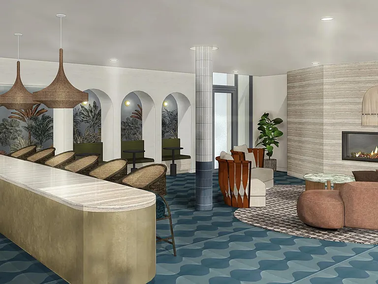 A warm, design-forward co-working lounge with bar seating, cozy corners, and inviting fireplace moments.