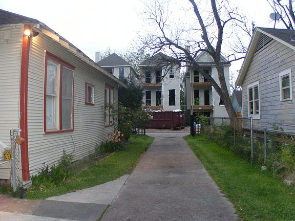 Side of home and new construction across street