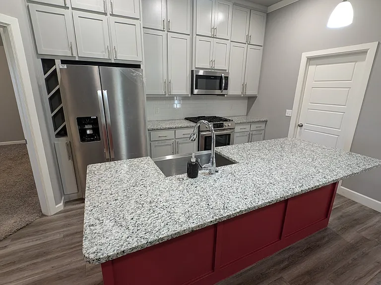 Kitchen Island & Gas Range & Oven.
