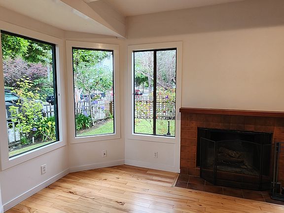 Living Room views of Front Yard and Private Side Patio