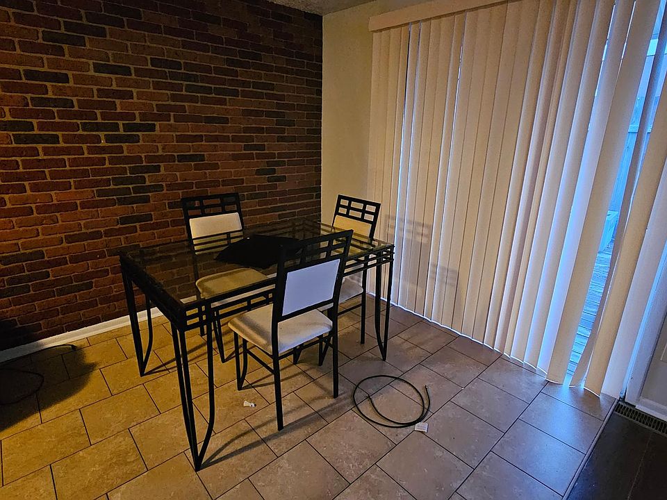 Dining area with blinds to the outside deck