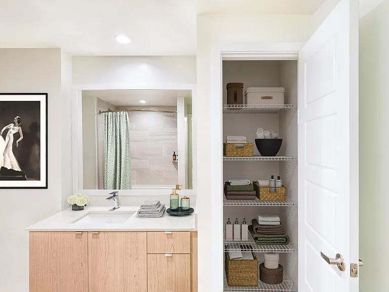 Bathrooms at Modera Aventura feature sleek vanities and convenient linen storage for everyday ease.