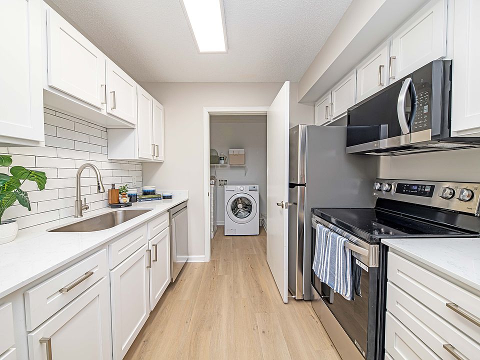 Kitchen with granite counters, modern cabinetry, and stainless steel appliances