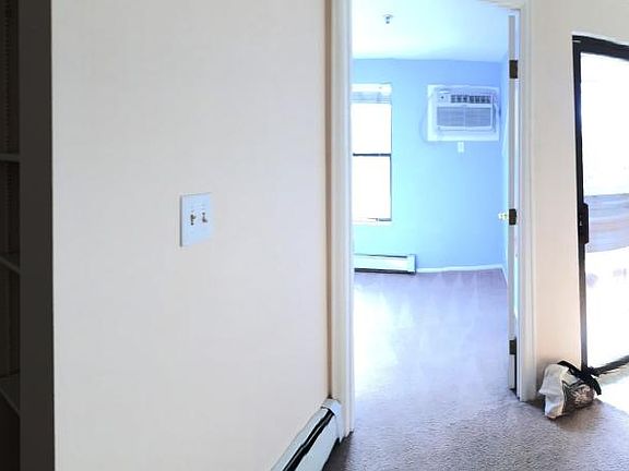 Panoramic Left to right: living room, bedroom, balcony door, kitchen, counter, closet, bathroom entry washer-dryer.
