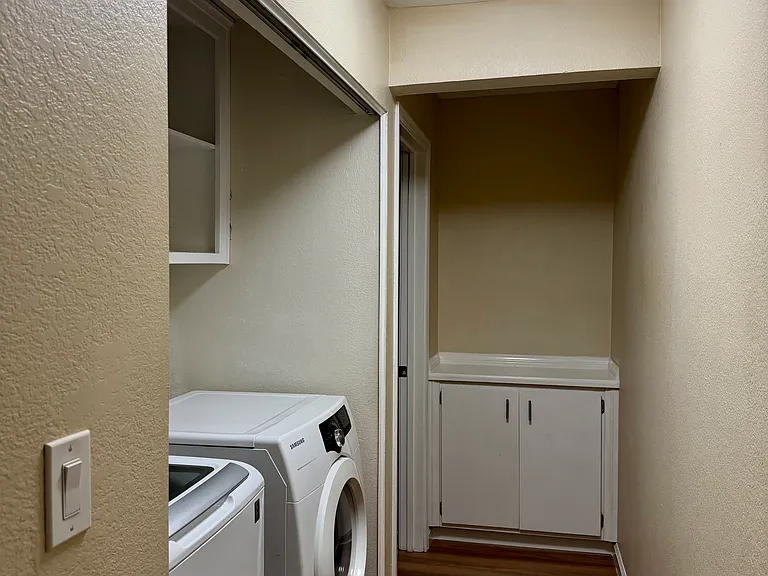 Hallway with washer and dryer