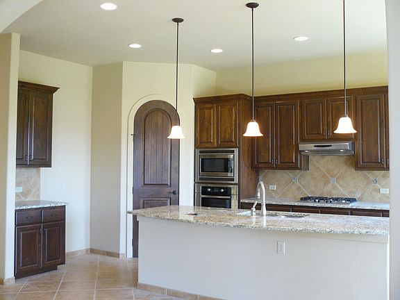 Kitchen with pantry, Granite counter tops and Notty Alder cabinets