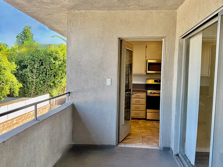Great lounge balcony with views~Sliding glass & kitchen entrances.