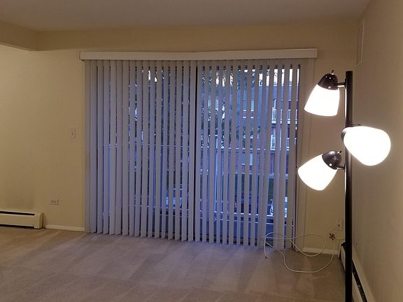LIVING ROOM WITH PATIO DOOR TO BALCONY
