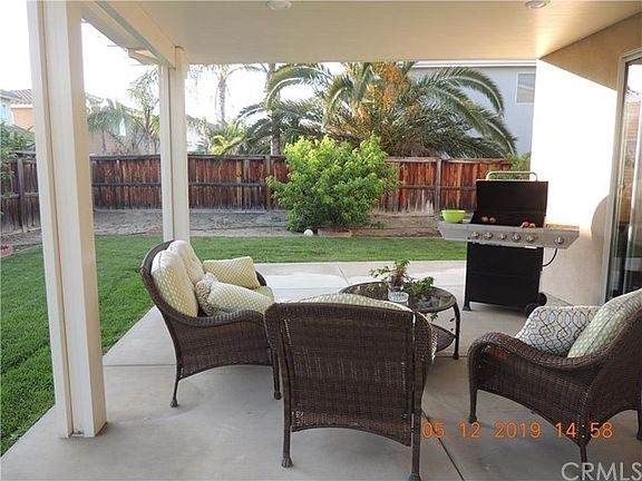 Backyard patio with fan & lights
