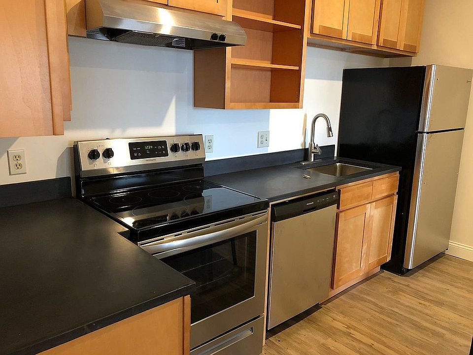 Stone countertops and stainless appliances with dish washer in each each unit.
