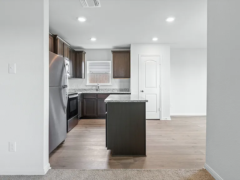 The kitchen of the Sabine sits in between the dining room and family room.