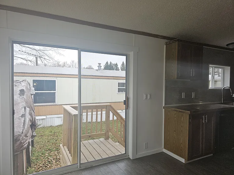 Sliding glass door off of the morning room/kitchen area that provides wonderful natural light