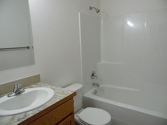 Great shower and tub combo. Easy to clean tub surround. Vanity with storage space. Neutral colors allow you to make it you space.