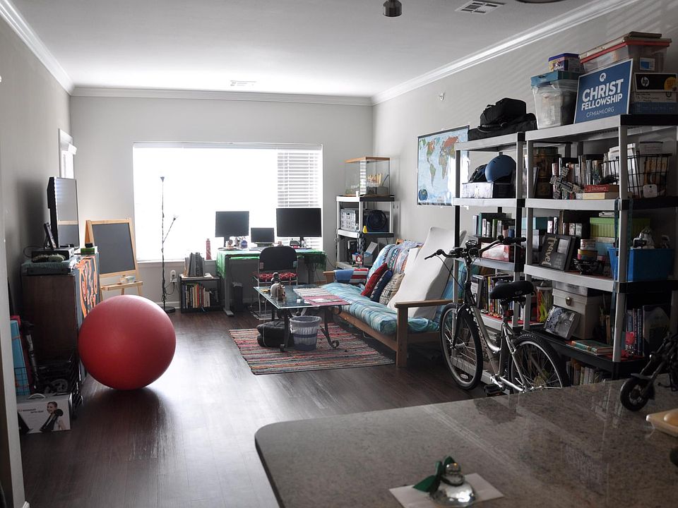 The windows face the South side. This is the length of the living room. Picture is taken from the kitchen.