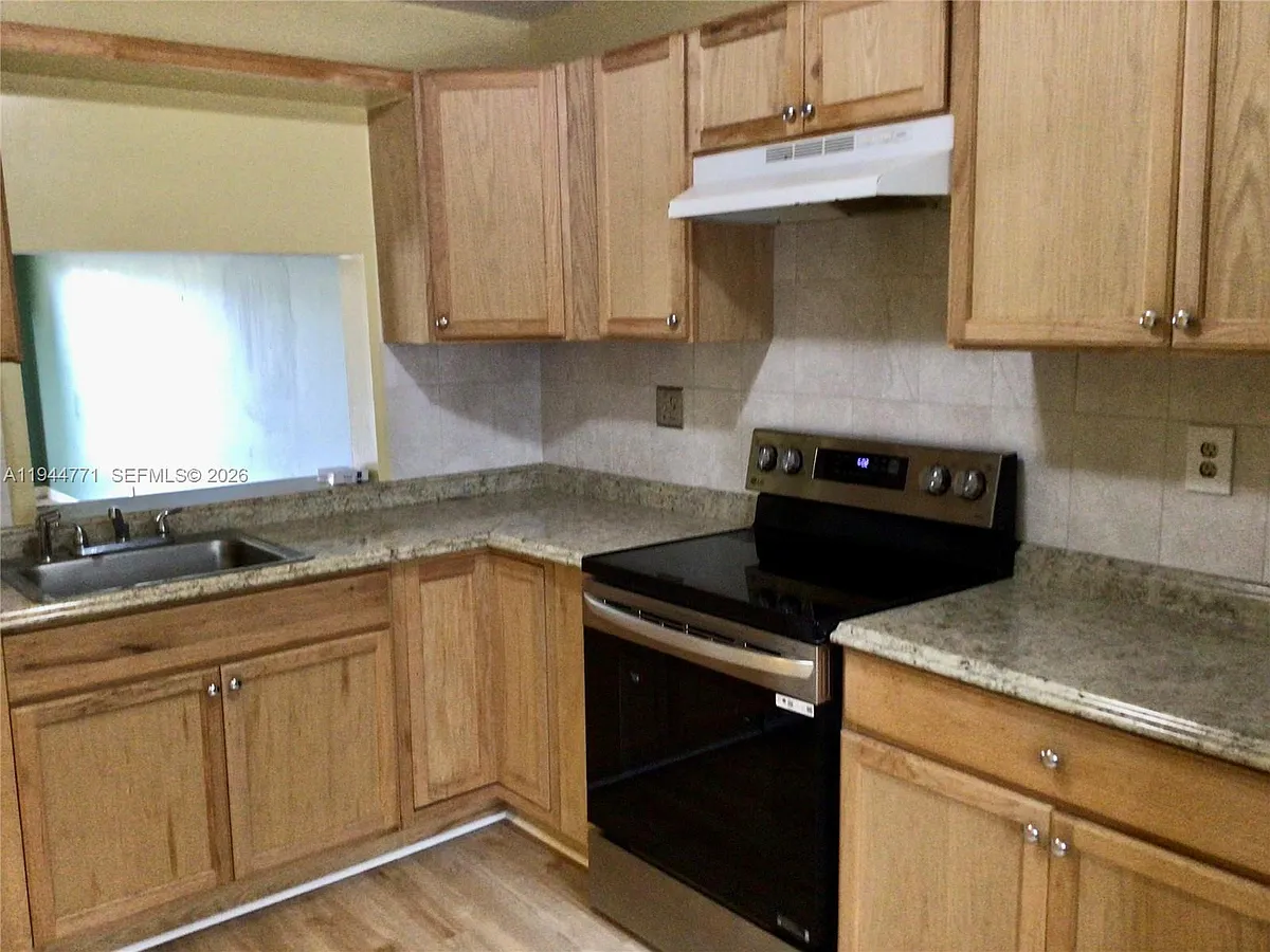 Photo 2 of 26 - 4722 NW 82nd Ave #1704 - Lauderhill, FL Building Photo - 4722 NW 82nd Ave #1704