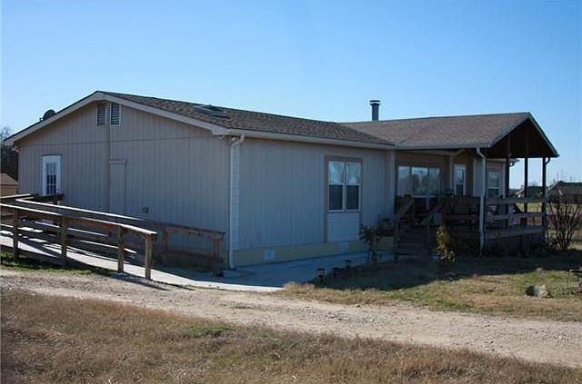 Exterior Front. Home has front porch and ramp for easy access.