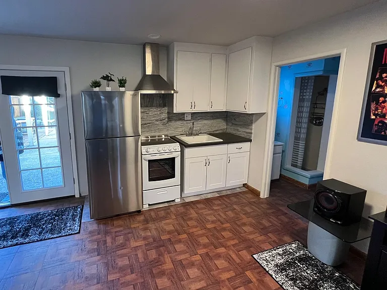 Casita kitchette with new refrigerator, new electric stove/hood, new canits, counter and sink