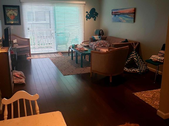 View from kitchen seating area to the living room