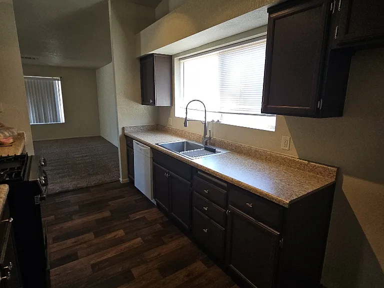 Kitchen includes gas range and dishwasher.
