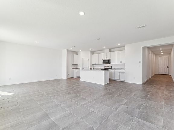 Great room of the Foxglove floorplan at Lakes at Bella Lago.