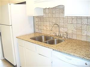 Tile backsplash and frig furnished