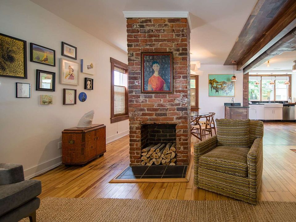 A cozy living and dining area right off of the kitchen with local art on the walls.