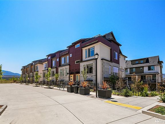 This amazing townhome has so much space between the unit and the building to the right, providing more privacy and one of the largest patios in the complex!