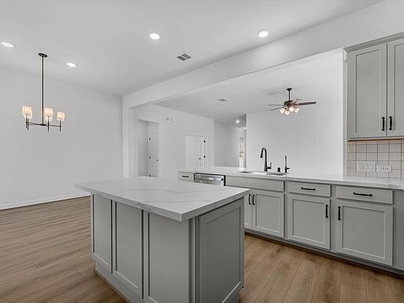 Kitchen. Sample product photo. Actual exterior and interior selections may vary by homesite. Photo m