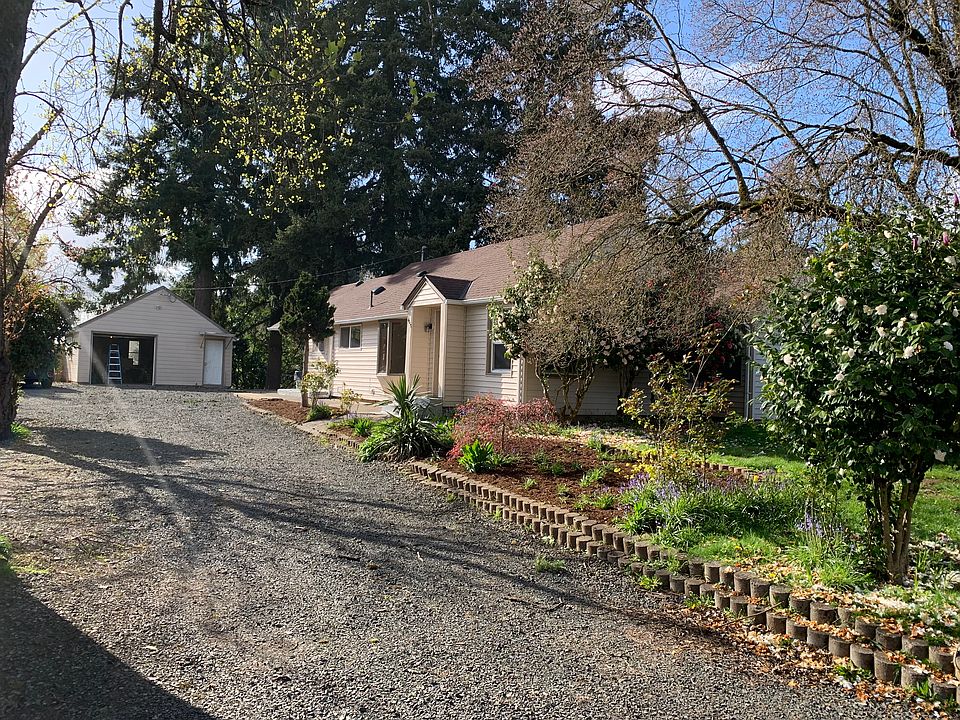 Home set back 100 feet from road with stand alone garage/shop