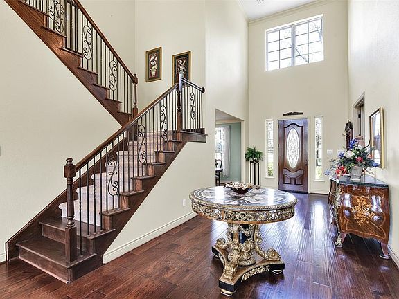 Soaring entry ceiling features high windows to allow natural light to fill the home. The extra wide hallway will allow your creativity to be expressed with unique furniture arrangements and designs.