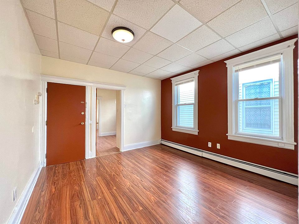 Living room with entrance door prior to tenants