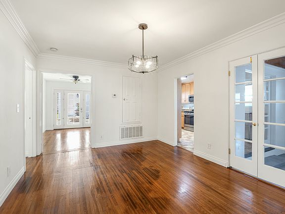 This is the formal dining room with access to the kitchen, a bedroom and another bedroom or office space.