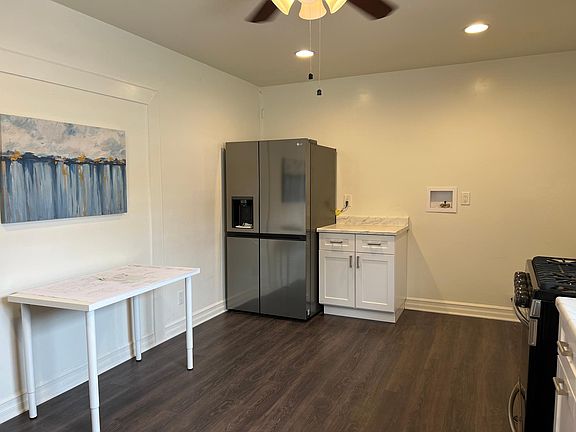 Brand new Stainless steel refrigerator with water and ice dispenser. Laundry hook up.