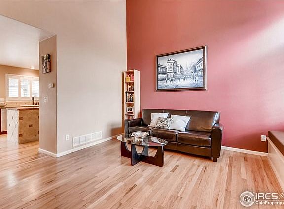 Vaulted living room with gleaming hardwood floors!