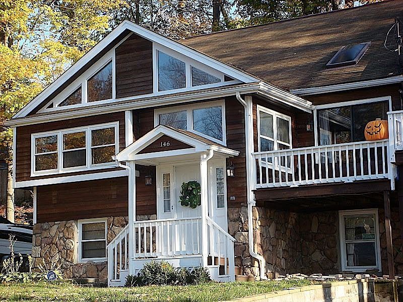 146 Castle Rock Rd. Freshly painted trim, stained wood siding & stone veneer.