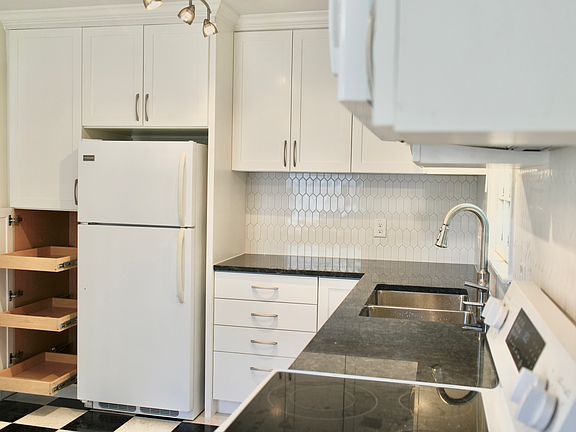 Kitchen cabinets (laundry room on left)