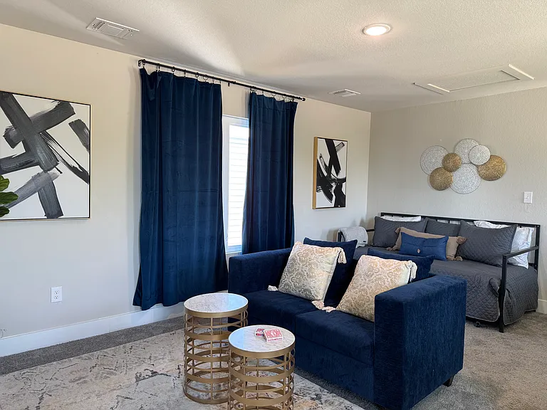 Upstairs Loft: sofa, twin trundle bed, and 50" ROKU Smart TV