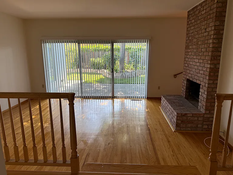 Front entryway view into living room and backyard.