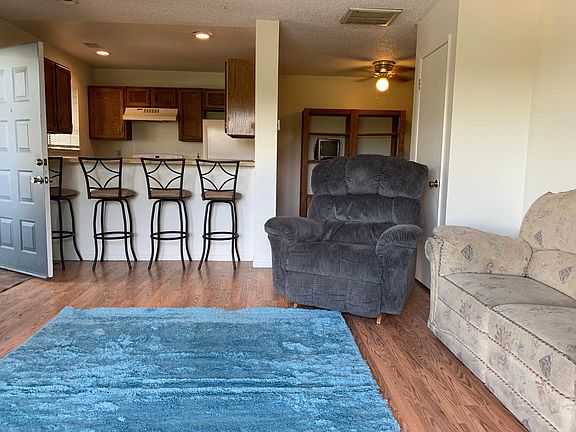 Wet bar separates living room from kitchen