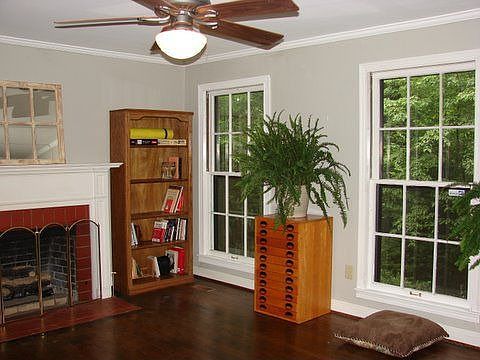 Living room w/ gas logs and park view