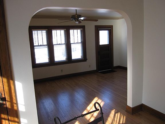 Sunny living room with door to front balcony